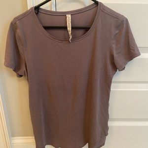 Lululemon tee. Washed on gentle and hung to dry. Soft with a loose fit.